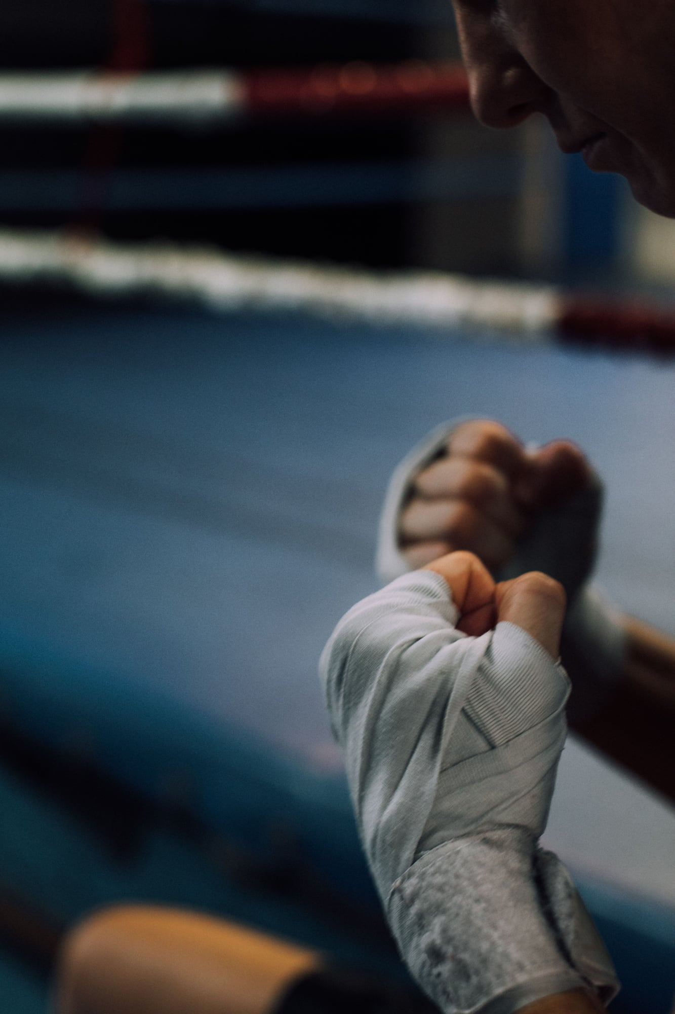 A wrapped fist in a quiet gym